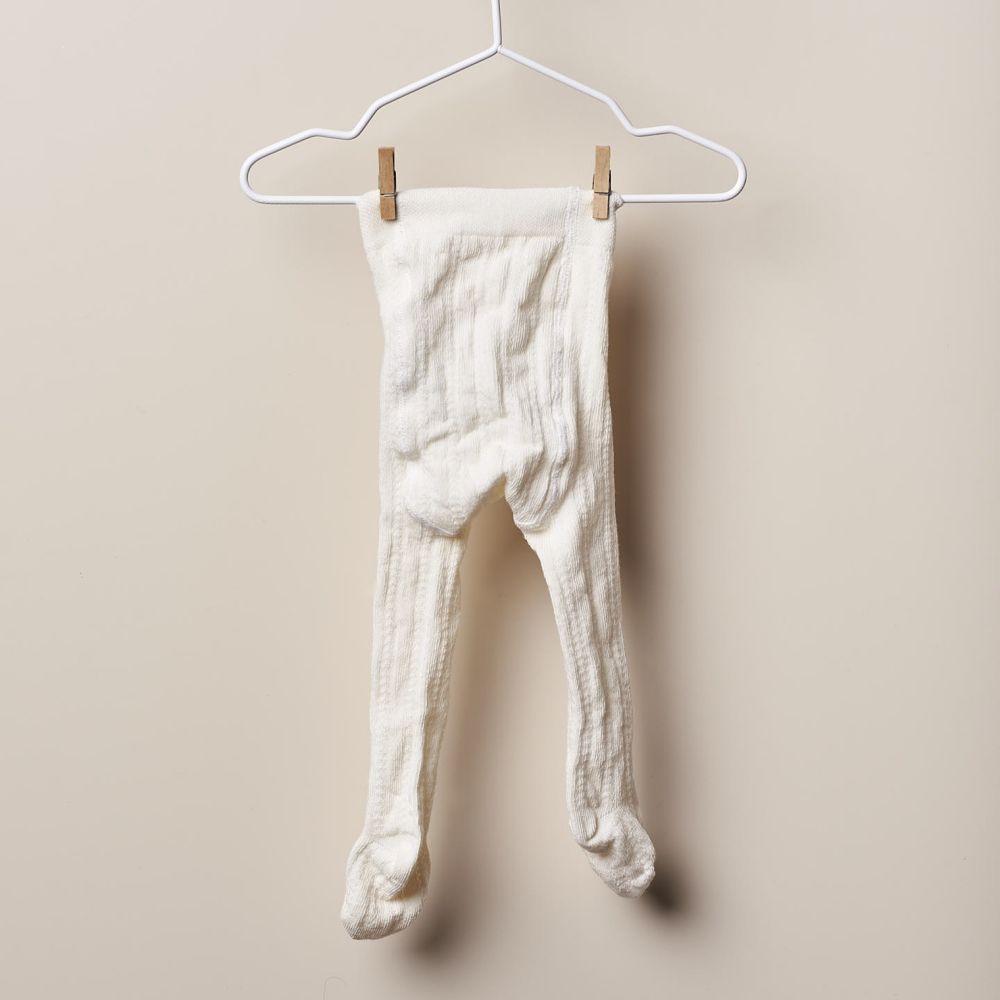 Collants de malha com design crochet para bebé | WINTER STORIES - Wedoble