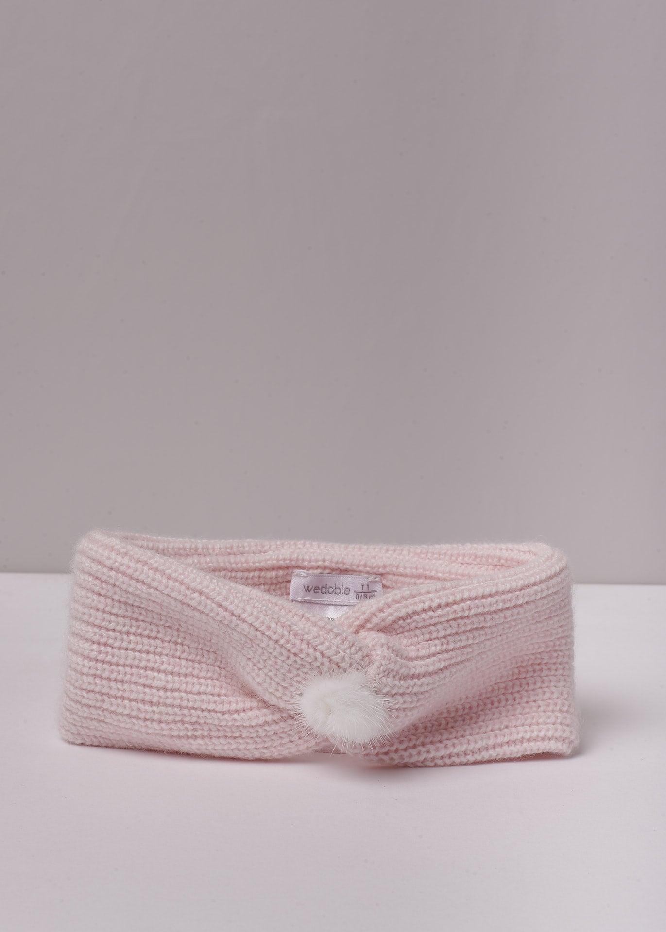 Fita com pompom em malha de lã