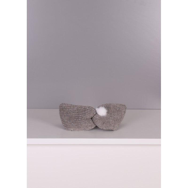 Fita com pompom em malha de lã
